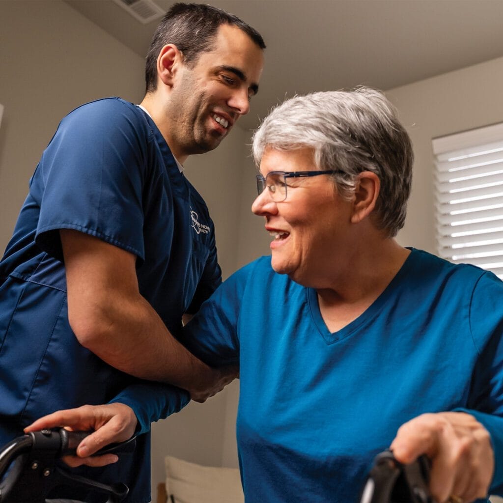 nurse helping a patient with mobility