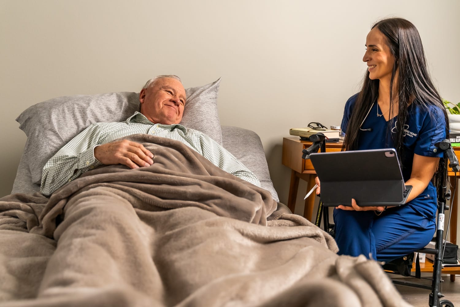 Hanford Home Health_Website Shoot_02.2025-09869 home health nurse spending time with a patient in his room