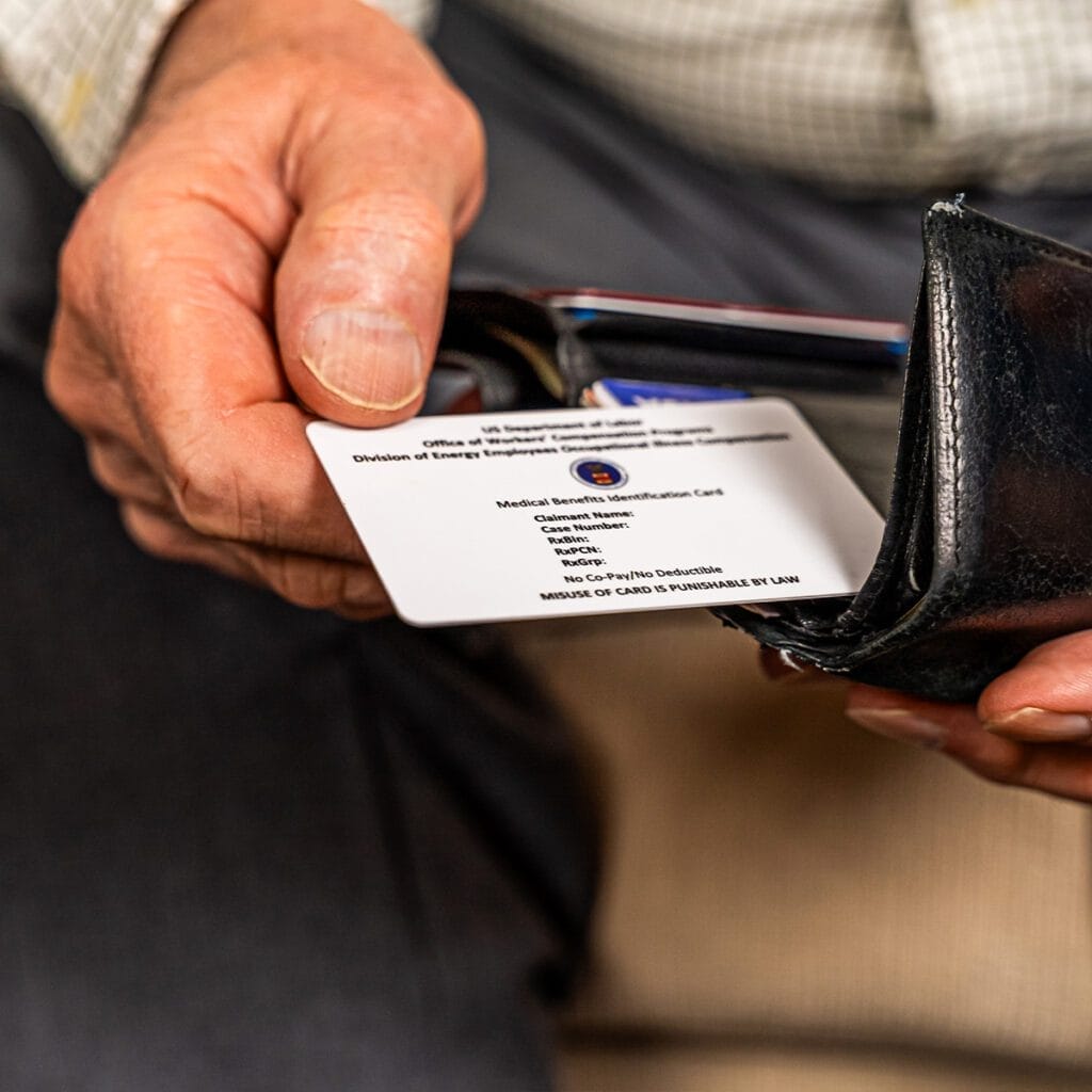 pulling white card out of wallet