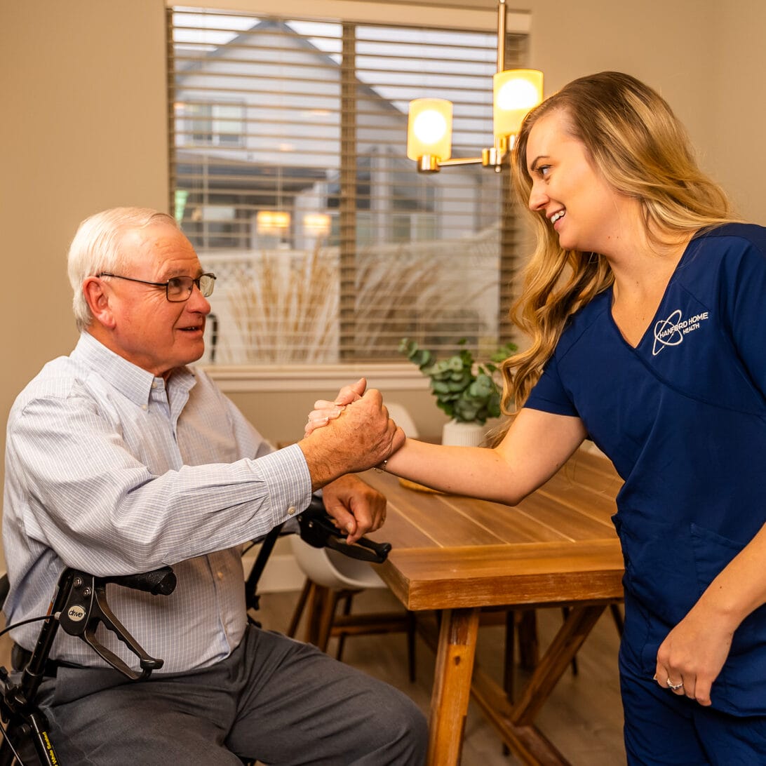 Hanford Home Health_Website Shoot_02.2025-00397 nurse helping a man out of his seat